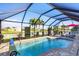 Sparkling screened-in pool area providing a tranquil outdoor living space and relaxing views at 429 Rotonda Cir, Rotonda West, FL 33947