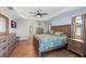 Relaxing main bedroom with a king-size bed and wood furniture at 497 Rotonda Cir, Rotonda West, FL 33947