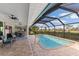 Screened pool and patio area with seating at 497 Rotonda Cir, Rotonda West, FL 33947