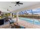 Screened pool and patio area with seating at 497 Rotonda Cir, Rotonda West, FL 33947