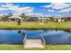 Serene canal-front view with private dock and lush greenery at 497 Rotonda Cir, Rotonda West, FL 33947