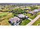 Beautiful aerial view of the neighborhood and adjacent golf course at 52 Marker Rd, Rotonda West, FL 33947