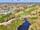 Panoramic aerial shot of the golf course and scenic community with water views at 52 Marker Rd, Rotonda West, FL 33947