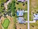 Overhead view of houses alongside golf course and community streets, showing the neighborhood layout at 52 Marker Rd, Rotonda West, FL 33947