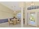 Bright dining area featuring elegant chandelier, lots of light and direct view of front yard at 52 Marker Rd, Rotonda West, FL 33947