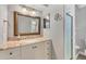 Bathroom with granite vanity, a large mirror, and a shower at 5292 Early Ter, Port Charlotte, FL 33981