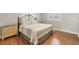 Bedroom with hardwood floors, a king-size bed, and a wooden dresser at 5292 Early Ter, Port Charlotte, FL 33981