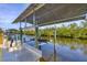 Covered boat lift with dock and water access at 5292 Early Ter, Port Charlotte, FL 33981