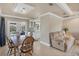 Bright dining area with wooden table and chairs near kitchen and living room at 5292 Early Ter, Port Charlotte, FL 33981