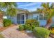 Inviting front entry with a brick walkway and lush landscaping at 5292 Early Ter, Port Charlotte, FL 33981