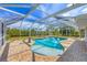 Relaxing kidney-shaped pool with screened enclosure at 5292 Early Ter, Port Charlotte, FL 33981