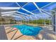 Inviting kidney-shaped pool with screened enclosure at 5292 Early Ter, Port Charlotte, FL 33981