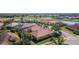 Aerial view of the house and surrounding neighborhood at 5560 Club View Ln, North Port, FL 34287