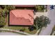 Top-down view of a house with red tile roof at 5560 Club View Ln, North Port, FL 34287