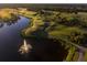 Aerial view of golf course with water features at 5560 Club View Ln, North Port, FL 34287