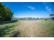 Backyard view of pond, fountain, and golf course at 5560 Club View Ln, North Port, FL 34287