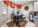 Kitchen breakfast nook with window seating and dark wood table at 5560 Club View Ln, North Port, FL 34287