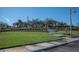 Community clubhouse with lush landscaping and parking at 5560 Club View Ln, North Port, FL 34287