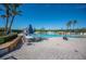 Resort-style pool with patio furniture and umbrellas at 5560 Club View Ln, North Port, FL 34287