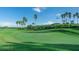 Golf course with palm trees and American flag at 5560 Club View Ln, North Port, FL 34287