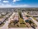 Aerial view shows a single-Gathering home in a residential neighborhood at 615 Apple Ln, Englewood, FL 34223