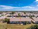 Aerial view shows a single-Gathering house and its backyard at 615 Apple Ln, Englewood, FL 34223