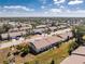 Aerial view of the house showing its backyard and location within the community at 615 Apple Ln, Englewood, FL 34223