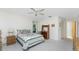 Well-lit bedroom with double bed, dresser, and window at 615 Apple Ln, Englewood, FL 34223