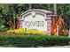 Foxwood community sign with lush landscaping; inviting entrance to the neighborhood at 615 Apple Ln, Englewood, FL 34223