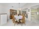 Bright dining room featuring a wooden table, chairs, and a china cabinet at 615 Apple Ln, Englewood, FL 34223