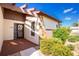 Front entry features a brick patio, stone accents, and a covered entryway at 615 Apple Ln, Englewood, FL 34223