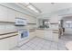 Bright kitchen with white appliances and ample counter space at 615 Apple Ln, Englewood, FL 34223