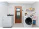 Laundry room with washer, dryer, and utility sink at 615 Apple Ln, Englewood, FL 34223