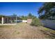 Backyard view showing a screened pool, storage shed, and fenced area at 6176 Catalan St, Englewood, FL 34224