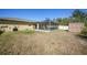 Backyard view showcasing a pool, screened enclosure, and shed at 6176 Catalan St, Englewood, FL 34224