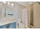 Updated bathroom with walk-in shower and modern vanity at 6176 Catalan St, Englewood, FL 34224