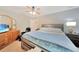 Main bedroom with king bed and ensuite access at 6176 Catalan St, Englewood, FL 34224