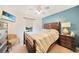 Guest bedroom with queen bed and ceiling fan at 6176 Catalan St, Englewood, FL 34224