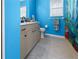 Bright blue bathroom with a shower and a vanity at 62 Marker Rd, Rotonda West, FL 33947