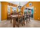 Rustic southwestern dining room with wooden table and chairs at 62 Marker Rd, Rotonda West, FL 33947