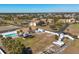 Complex view showing multiple buildings, a pool, and surrounding landscape at 6699 San Casa Dr # T1, Englewood, FL 34224