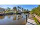 Wooden boardwalk leads to private dock on calm waterway at 6699 San Casa Dr # T1, Englewood, FL 34224