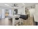 Modern kitchen with island, stainless steel appliances, and dark cabinetry at 6699 San Casa Dr # T1, Englewood, FL 34224