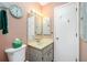 Simple bathroom with a beige vanity and toilet at 7035 Sunnybrook Blvd, Englewood, FL 34224