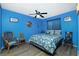 Bedroom with a nautical-themed comforter and two chairs at 7035 Sunnybrook Blvd, Englewood, FL 34224