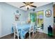 Dining area with white table and chairs, and access to a screened porch at 7035 Sunnybrook Blvd, Englewood, FL 34224