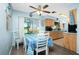 Charming dining area with a table, chairs, and a view into the kitchen at 7035 Sunnybrook Blvd, Englewood, FL 34224