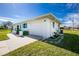 Garage and front yard view of home at 7035 Sunnybrook Blvd, Englewood, FL 34224