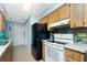 Kitchen with granite countertops and teal backsplash at 7035 Sunnybrook Blvd, Englewood, FL 34224