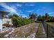 Large backyard with hedge and chain link fence at 7336 Brookhaven Ter, Englewood, FL 34224